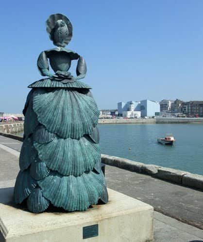 Sophia looks out from Margate Pier towards Boulogne (Shell lady sculpture by Ann Carrington)